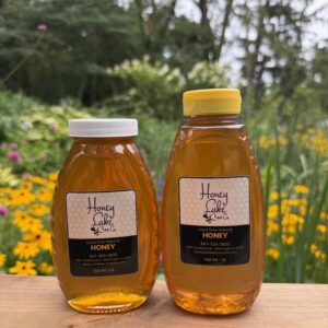 1 pound of local raw honey in glass or plastic