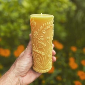 Intricate candle against floral background