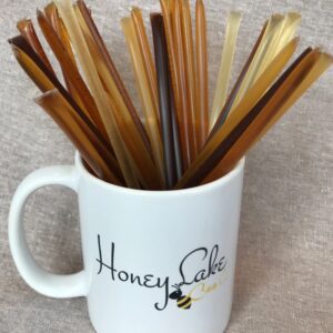 Honey sticks in a branded mug