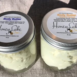 Two jars of luxurious body moisturizer