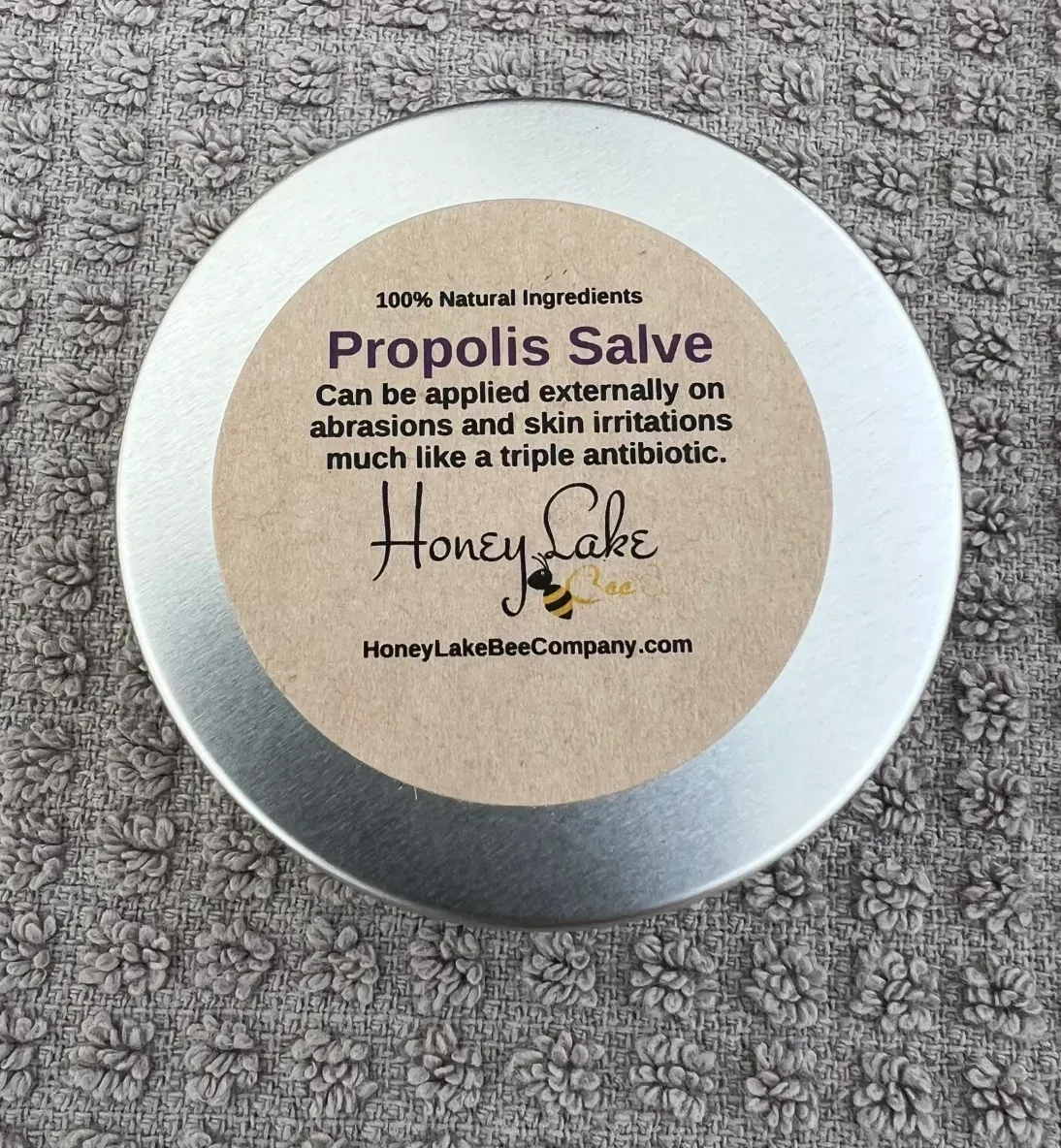 Natural propolis salve container top view