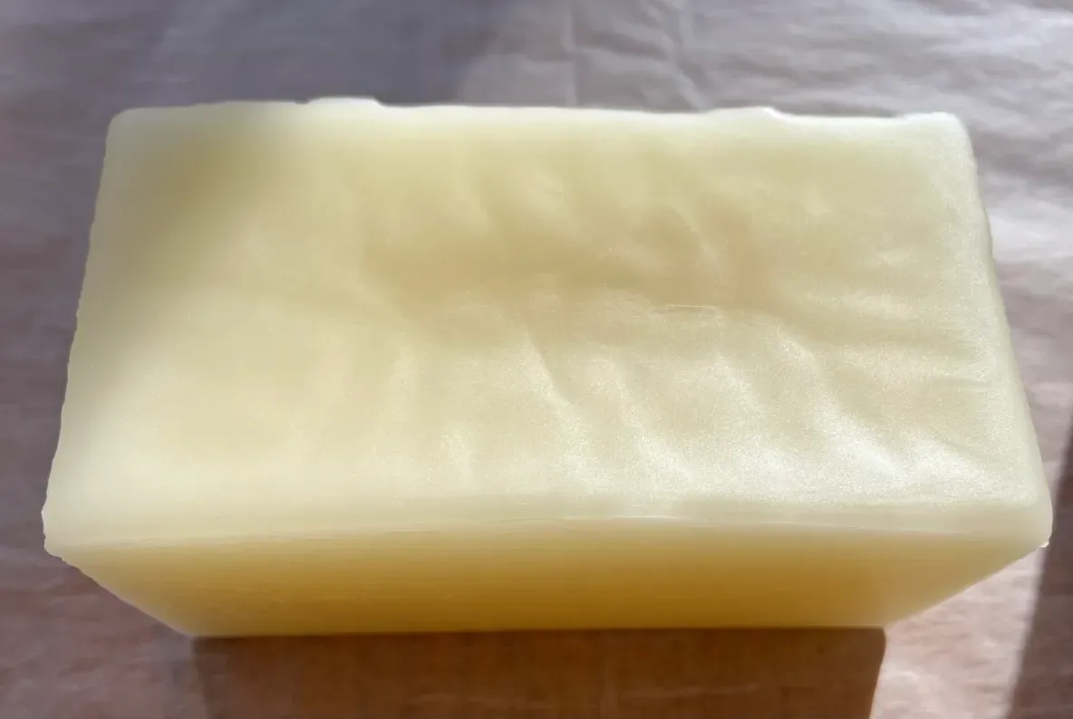 Beeswax block on wooden surface