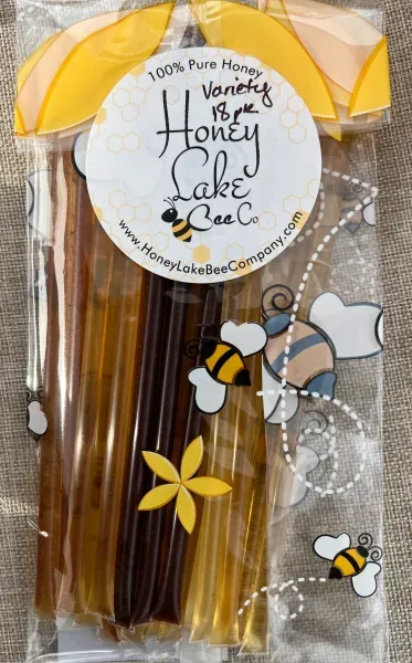 Packaged honey straws with bee design