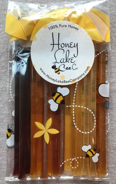Honey sticks with bee-themed packaging
