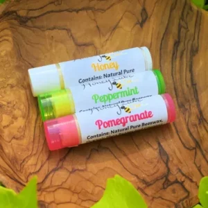 Lip balms on wooden dish