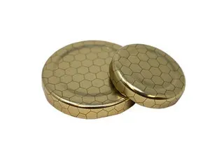 Two metallic hexagon-engraved containers