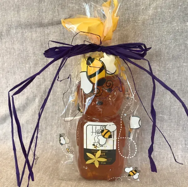 Honey bottle in festive wrapping