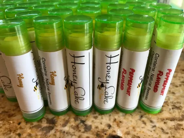 Lip balms with green caps and labels
