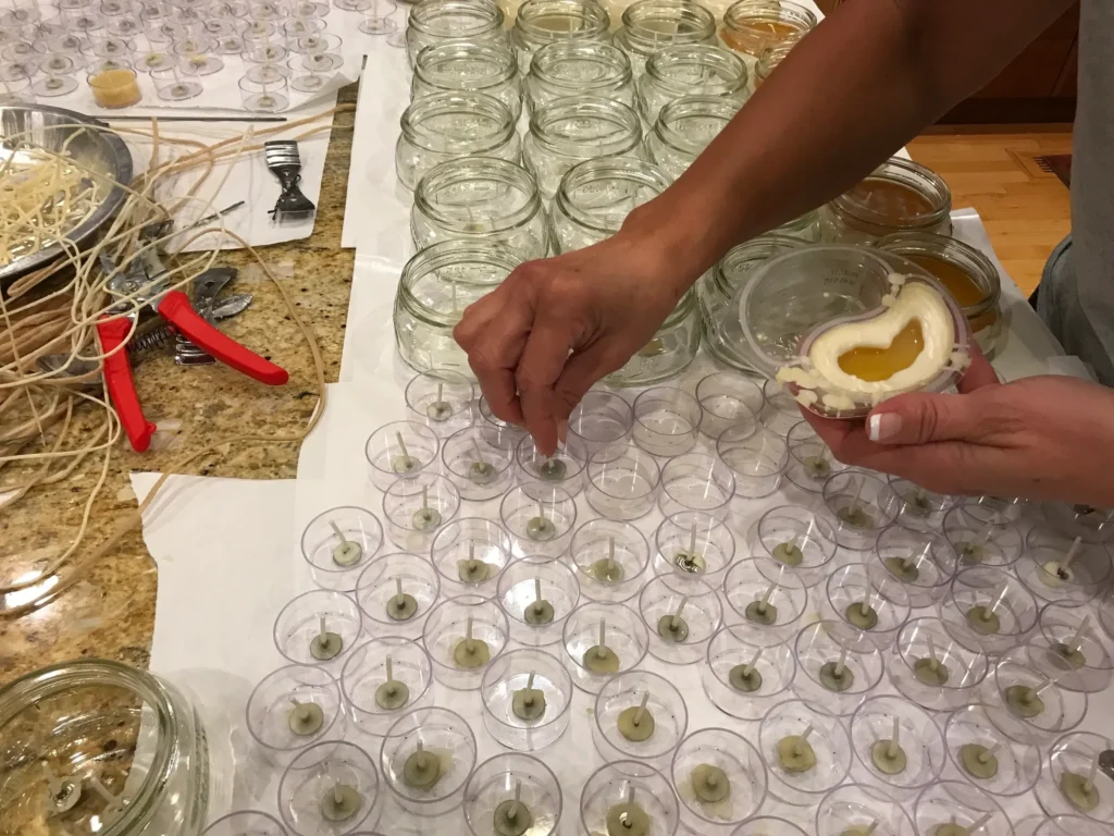 Arranging wicks in glass jars