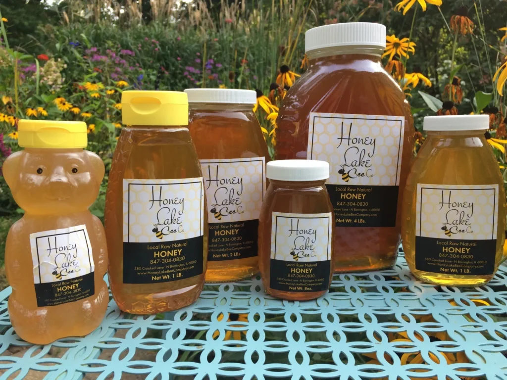 Honey jars on a floral table