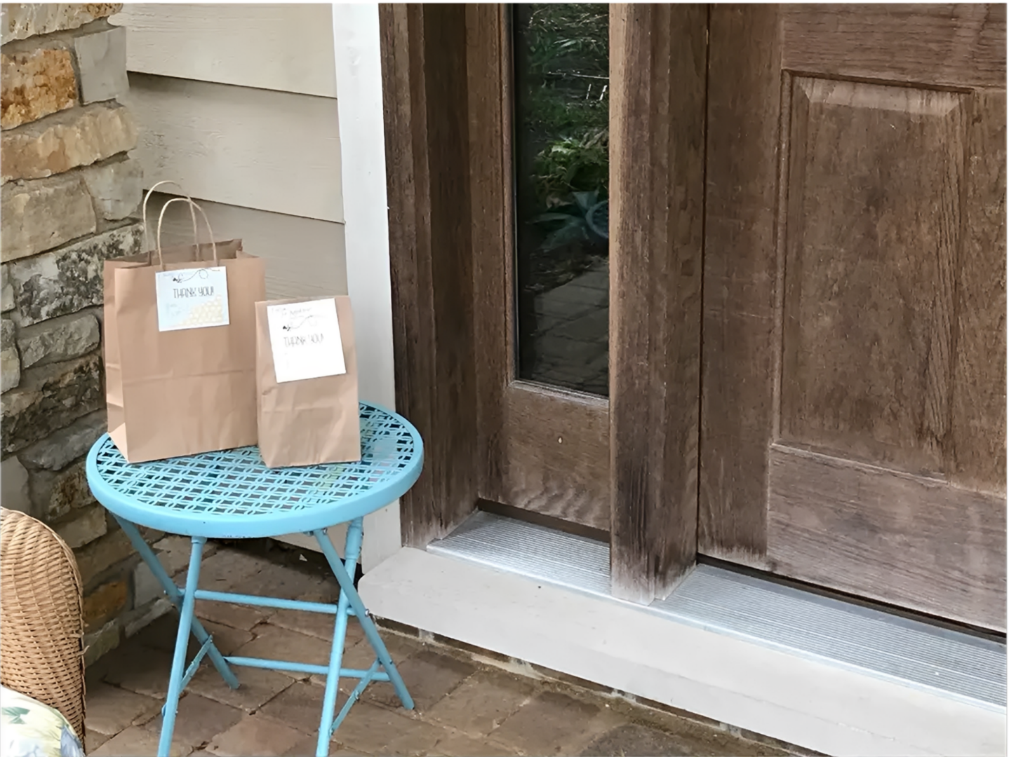Brown paper bags by a wooden door