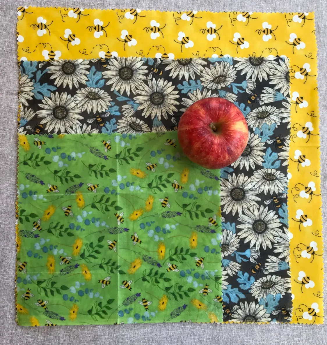 Colorful fabric squares and apple