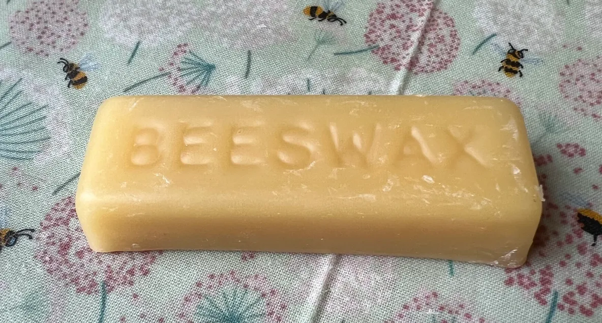 Yellow beeswax block with bees
