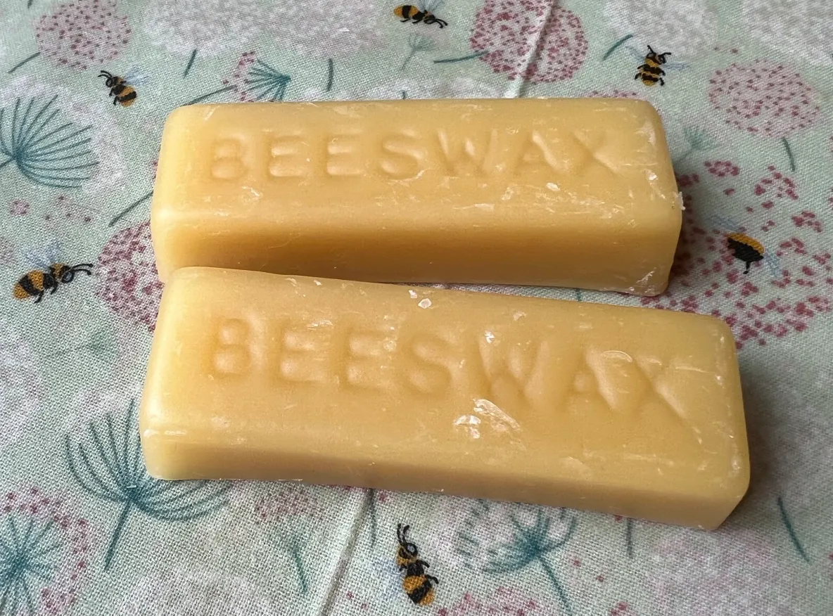 Yellow beeswax on decorative cloth