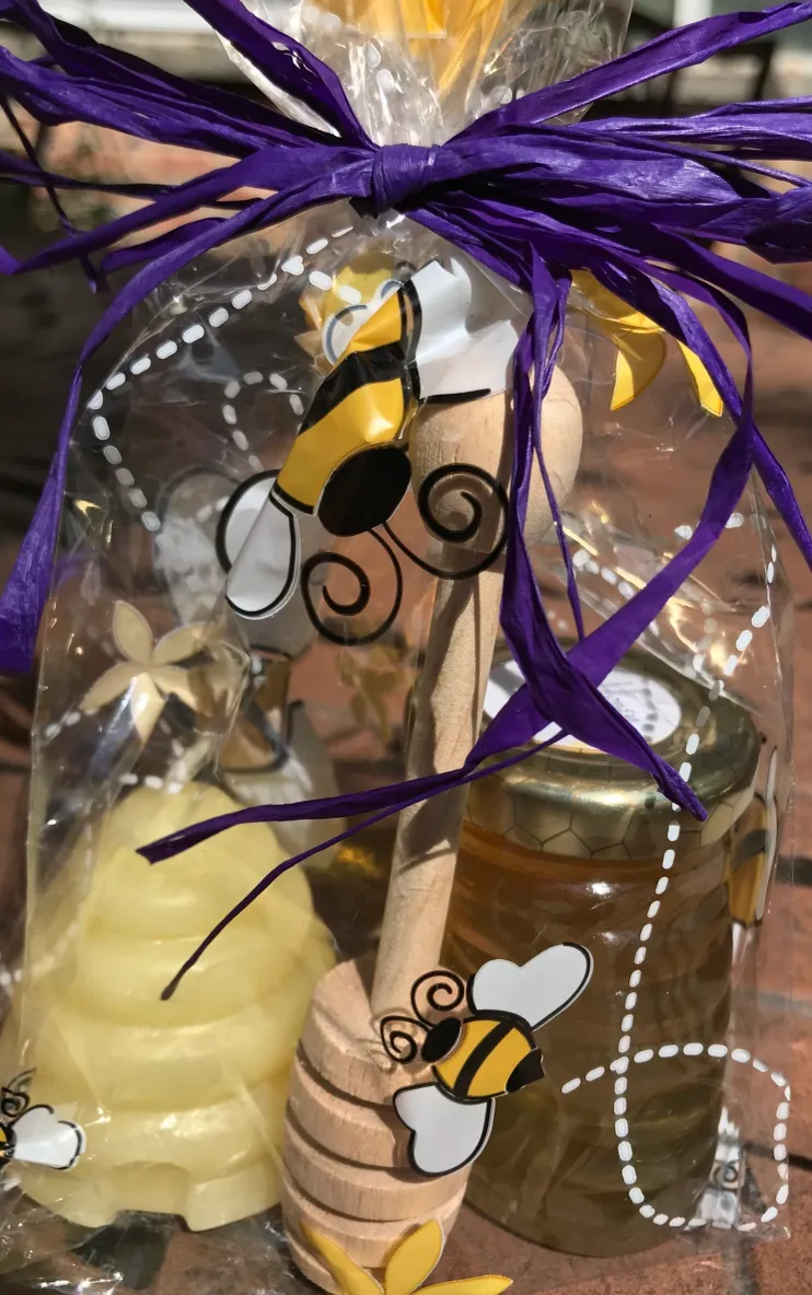 Decorative honey jar and wooden dipper