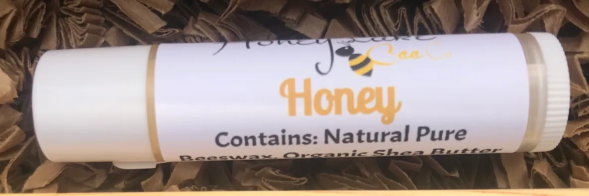 Organic lip balm tube with honey label